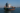Navio de carga com bandeira brasileira atracado em estaleiro, ilustrando o Registro Especial Brasileiro (REB) e os benefícios fiscais para a indústria naval.